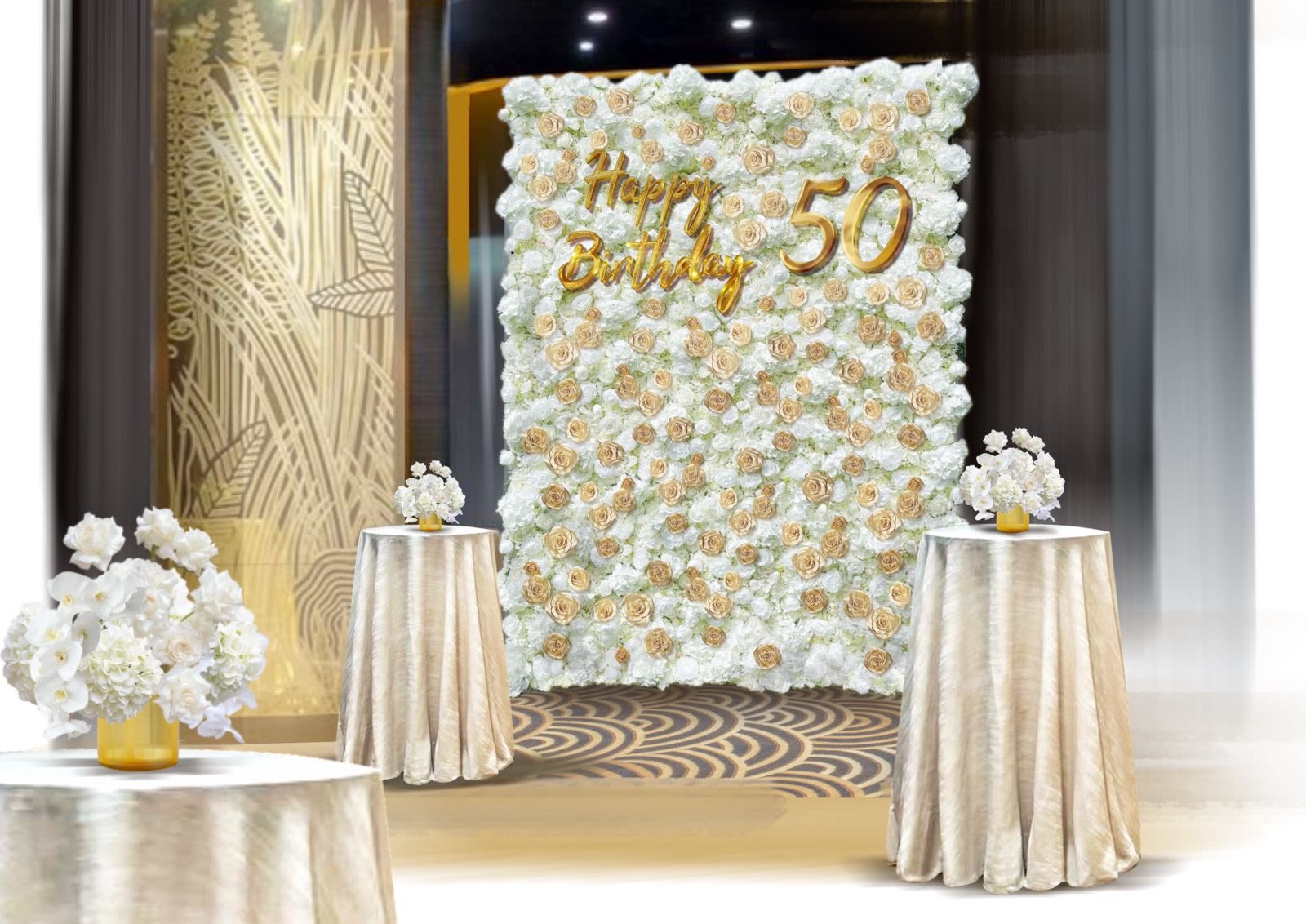 White floral wall with gold "Happy Birthday 50" lettering and matching table arrangements
