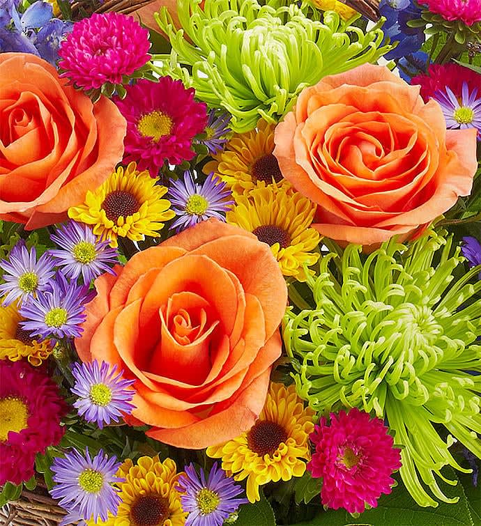 Bouquet of orange roses and colorful daisies