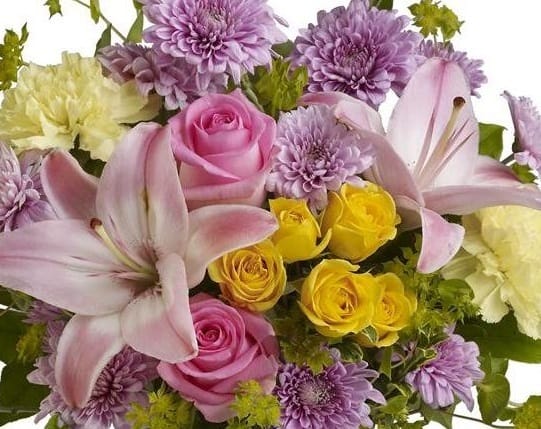 Designers Choice Pastel Arrangement - A beautiful mix of of our freshest blooms in pastel colors designed in a glass vase