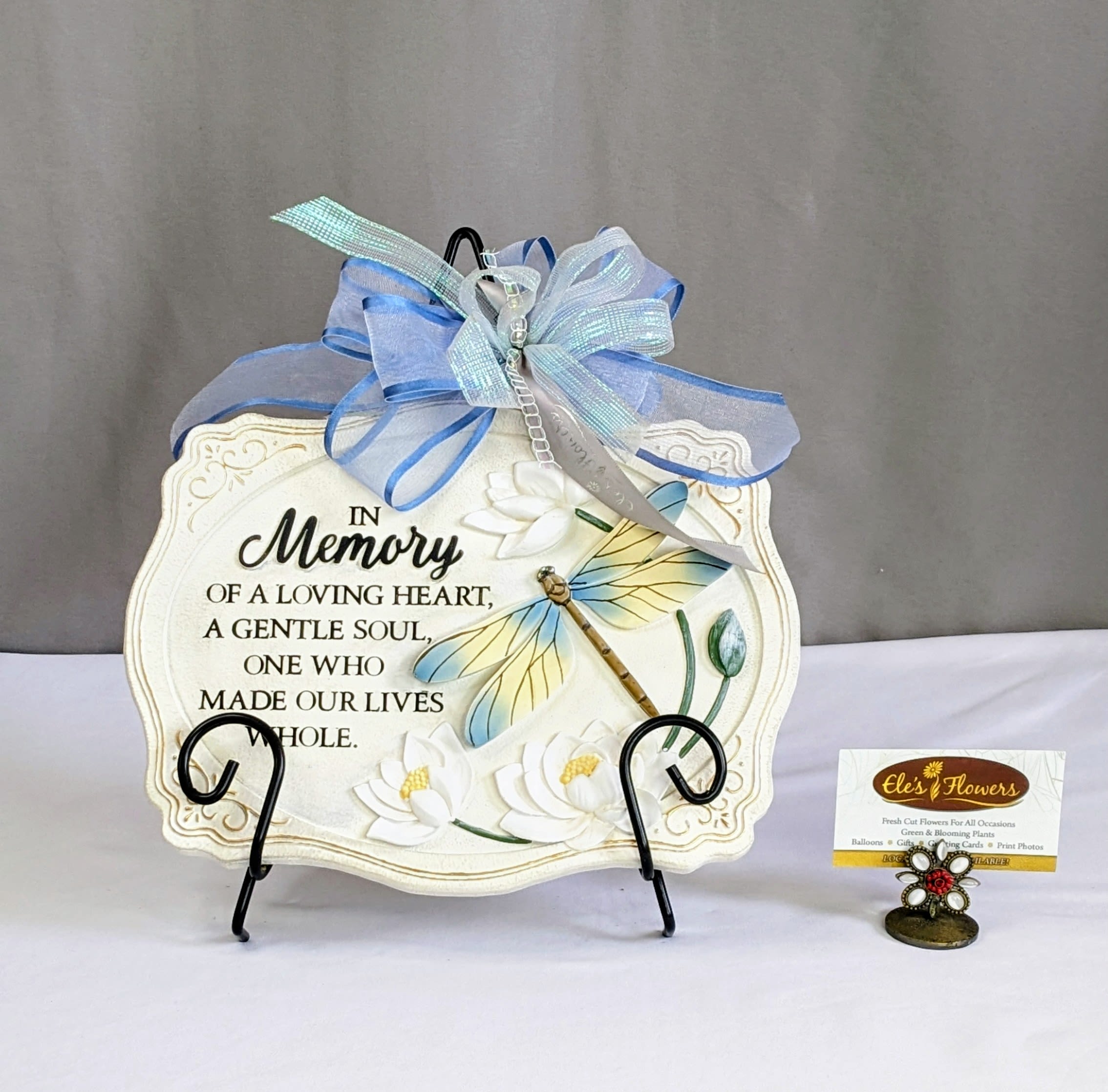 Sympathy Stone - Gentle Heart - A sympathy stone is a heartfelt memorial gift, crafted from durable resin. Engraved with comforting words, symbols, and images, it serves as a lasting tribute to a loved one, providing solace during times of grief. Perfect for gardens, memorial areas, or indoor displays, this stone is a meaningful reminder of love, loss, and cherished memories.  This stone has the phrase, "In Memory of a loving heart, a Gentle soul, one who made our lives whole." Stand included.  Approximate Dimensions: 9"H x 11"W
