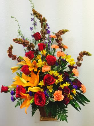 Sunset Memories  - Item # TLS-S112 Red and Orange display of Roses and Lilies convey a wonderful tribute the family will appreciate.