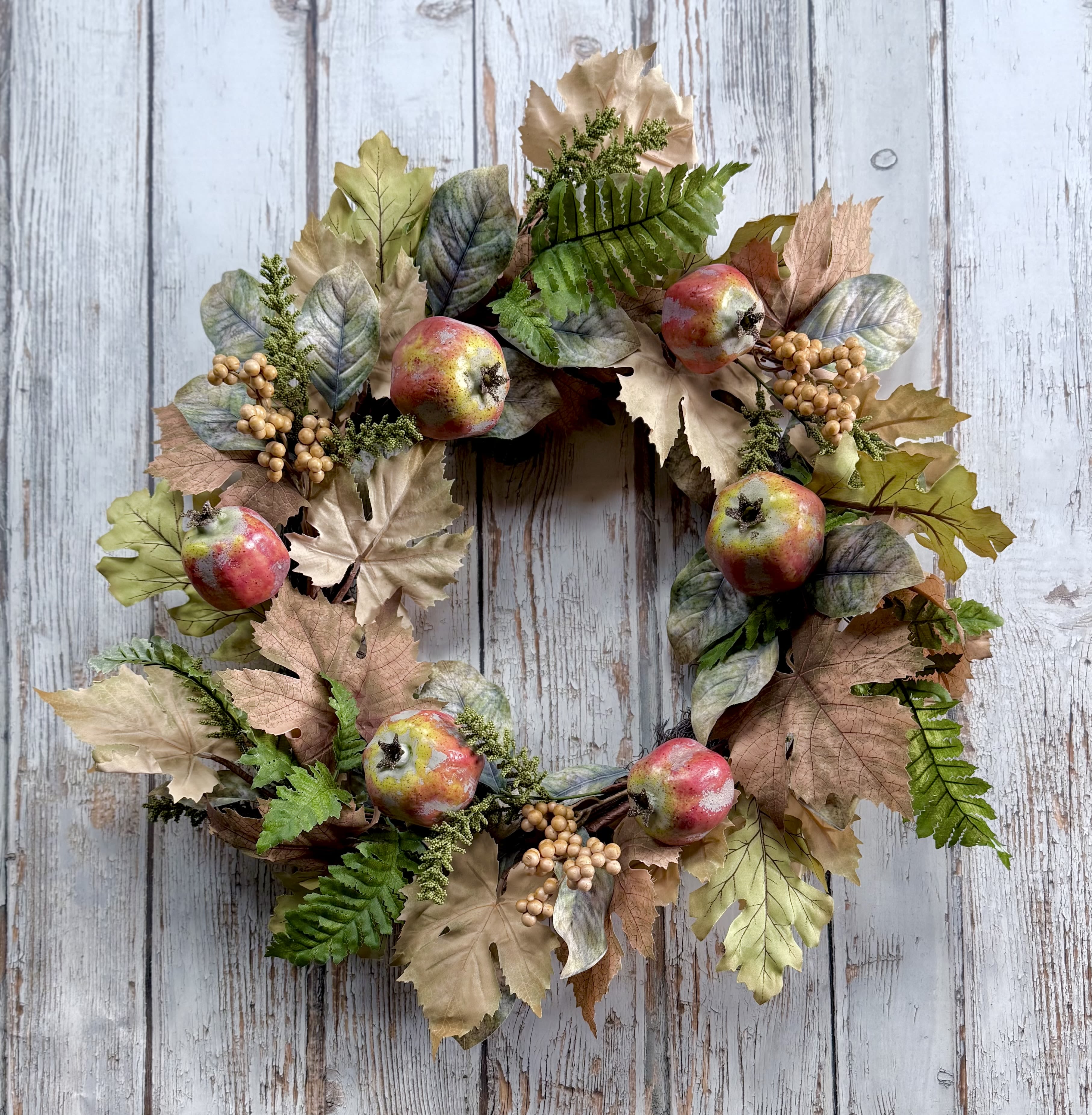 Pomegranate Fall Wreath  - A soft muted toned fall wreath perfect for the front door. Measures 22” in diameter and made of all artificial flowers and pomegranates to withstand outdoor elements. 