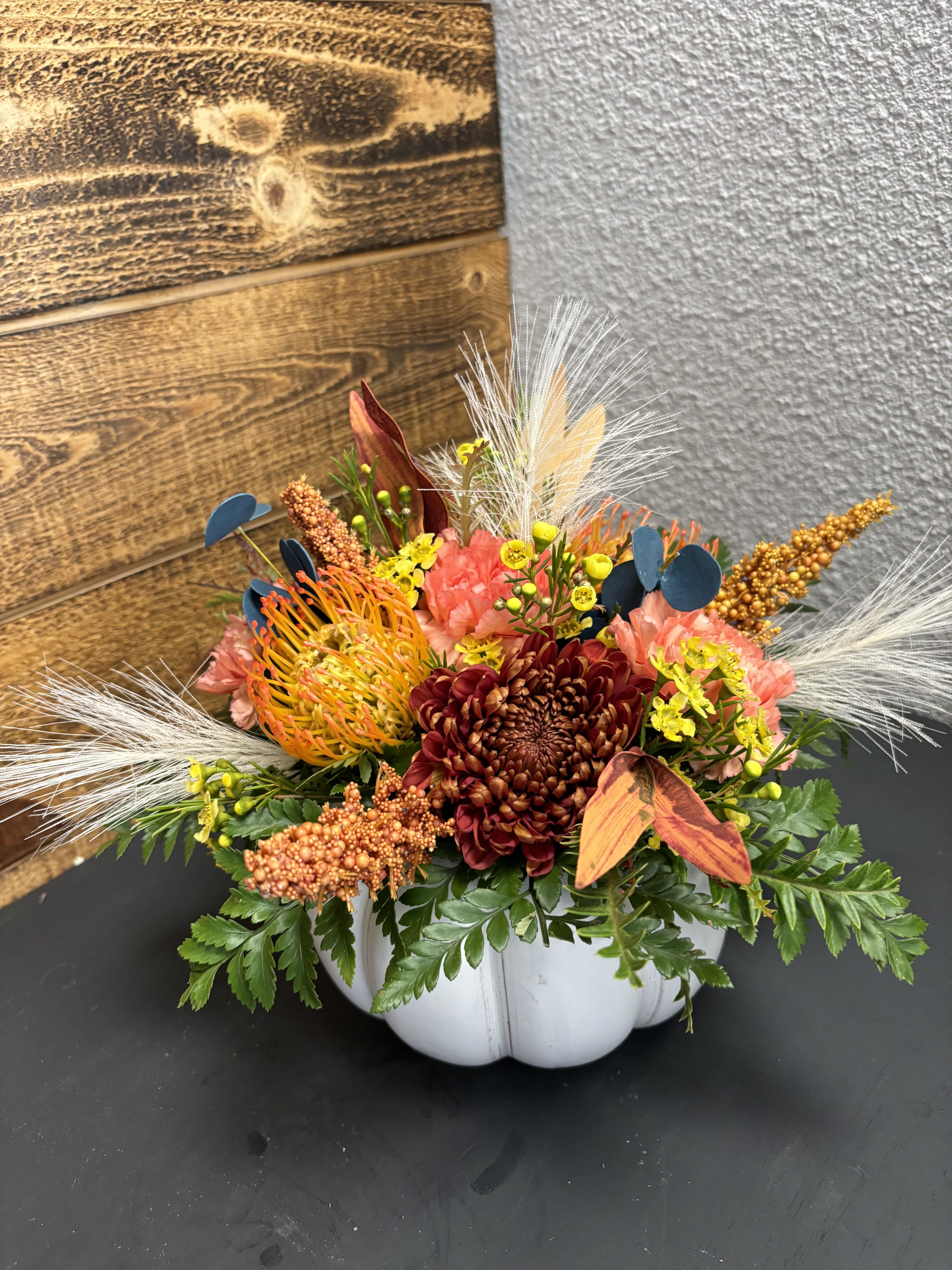 Mod Fall Pumpkin - White ceramic pumpkin container with a mix of dried and live florals. 