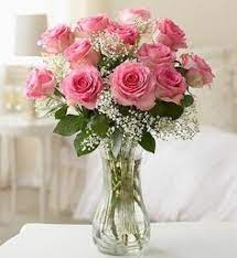 Dozen Pink Roses In Vase - These pink roses are cheerful and fun! Dozen Long Stemmed Pink Roses by BloomNation™ is the perfect gift to show your love and appreciation.  APPROXIMATE DIMENSIONS: 25" H X 18" W  