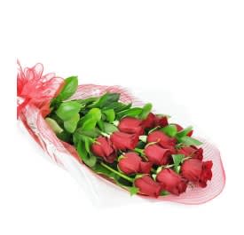 Bouquet of red roses wrapped in pink mesh