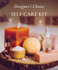 Self-care gift kit with a candle, lotion, and bath items