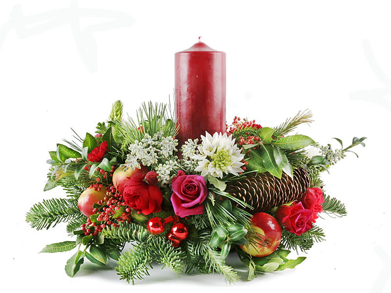 Holiday centerpiece with red candle, roses, and evergreen accents