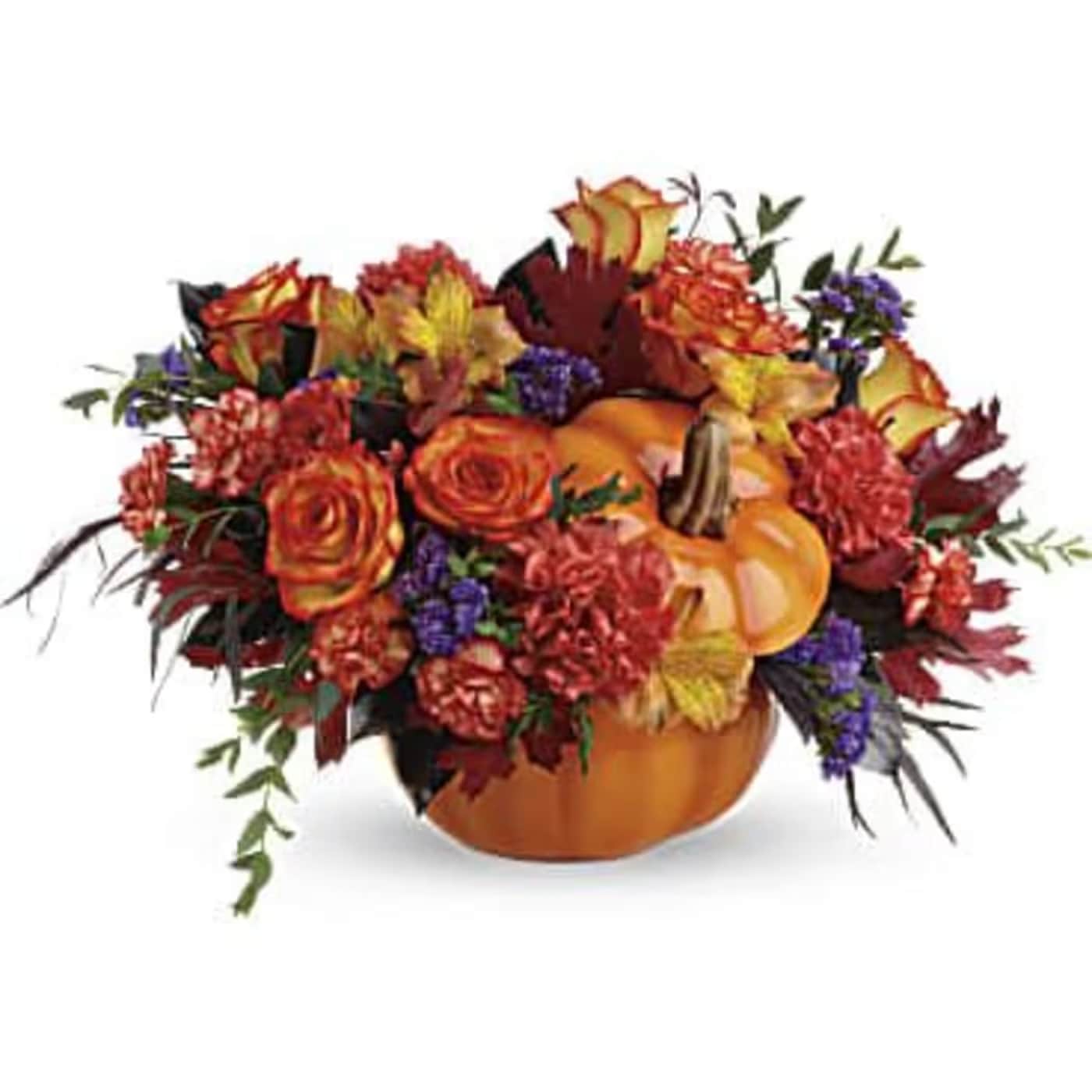 Pumpkin Party - The arrangement features a variety of autumn-themed flowers and greenery in a keepsake ceramic pumpkin. Perfect addition to anyone's Autumn Decor  