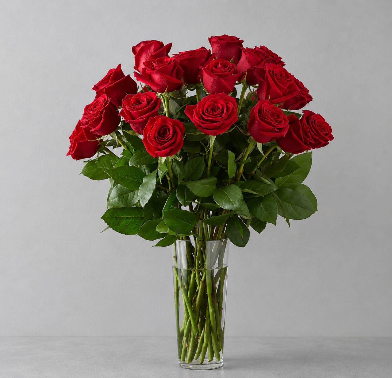 Two Dozen Long Stem Red Roses - Red roses are timeless, classic and iconic. Whether it's a romantic gesture or a meaningful gift to share how much you care, this bouquet of two dozen roses is bound to make your loved one swoon with 24 red roses.  