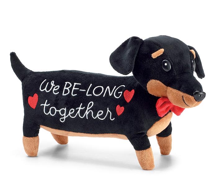 Black plush dachshund with "We BE-LONG together" text and red hearts