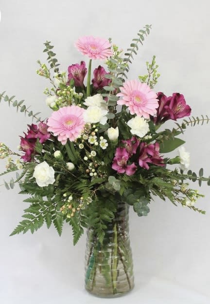 Pink and white mixed bouquet in a glass vase