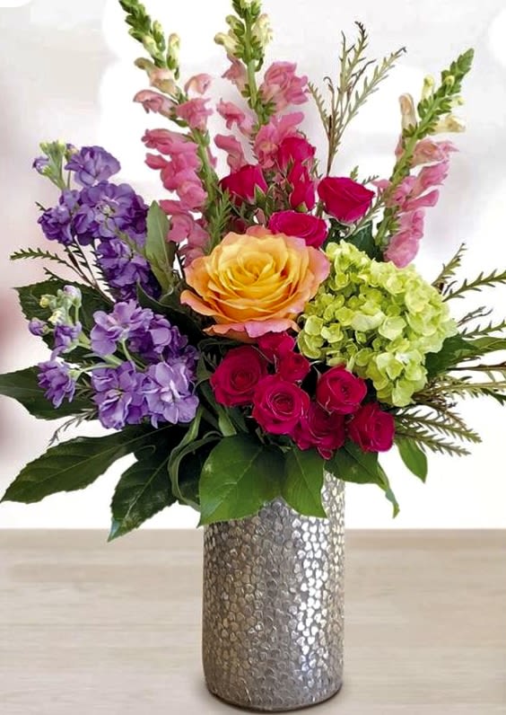 Garden Beauty  - Purple stock ,pink snapdragons,green hydrangea, Hot pink spray roses ,Salal , Ivanho ,free spirit rose ,