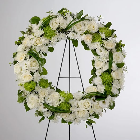 Lasting Serenity by BloomNation™  - A beautiful white and green tribute wreath that calms, this easel arrangement celebrates a full life and a peaceful passing. 