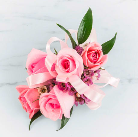 Pink Rose Corsage by BloomNation™  - A classic pink corsage hand-tied in pink satin that compliments any outfit. A beautiful addition to any prom, formal, or wedding event. 
