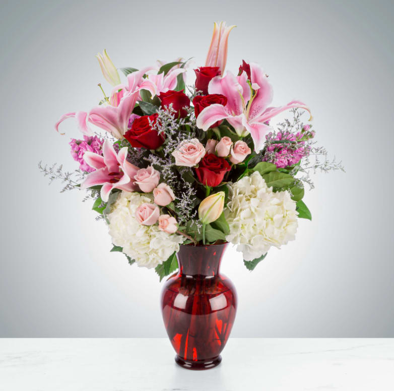 Be Mine by BloomNation™ - If your partner's love language is gifts, don't sweat it. This classic (and big!) arrangement is a perfect way to celebrate and show your love. Whether it be Valentine's Day, an anniversary, or a random Tuesday, this arrangement will be sure to wow.  Approximate Dimensions: 20"D x 25"H