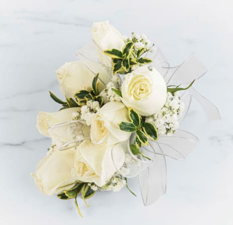 White Rose Corsage by BloomNation™  - A classic white corsage with silver sheer ribbon, this wrist arrangement looks good with any outfit. A perfect compliment to any prom, formal, or wedding event. 
