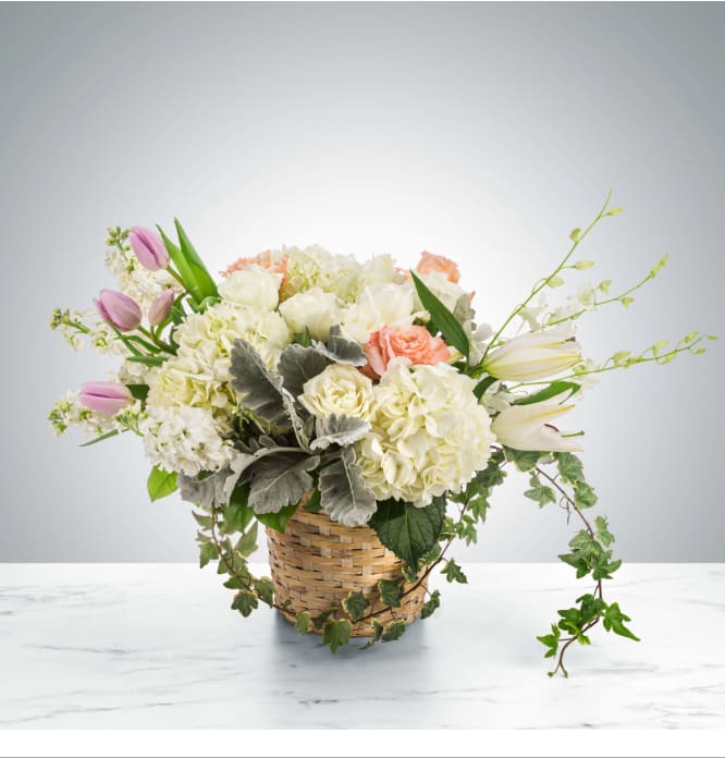 Lean on Me by BloomNation™ - A large pastel-colored basket suitable for sending to the home after the service, Lean on Me by BloomNation™ features roses, hydrangeas, tulips, ivy, and dendrobium orchids.  Approximate Dimensions: 18"D x 12"H