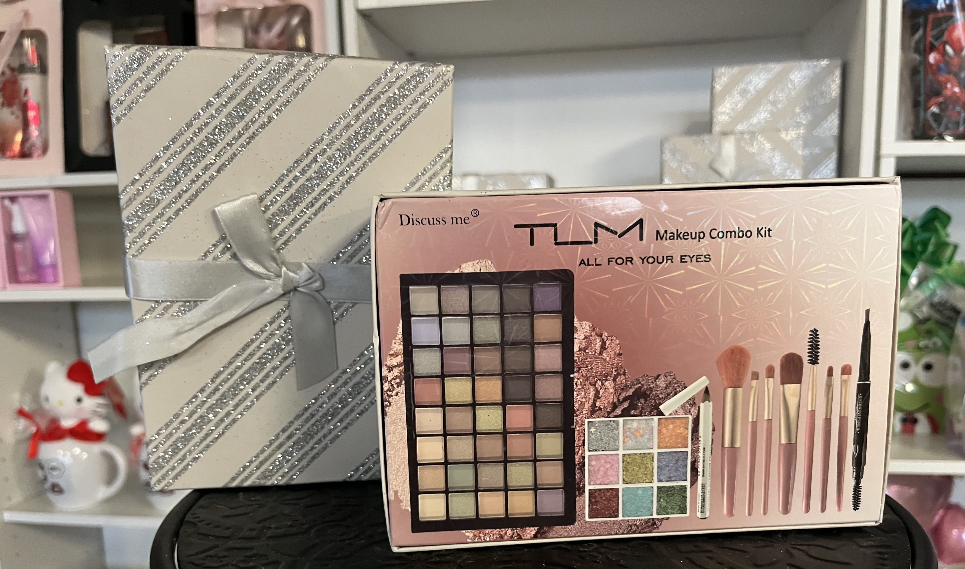 Gift boxes and a makeup combo kit with eyeshadow and brushes