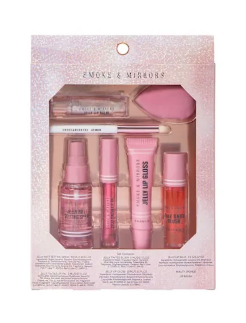 Pink makeup gift set in a glittery box with lip gloss and applicators