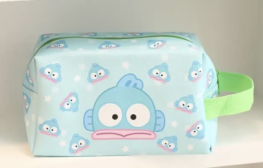 Light blue zippered pouch with cartoon fish faces and a green handle