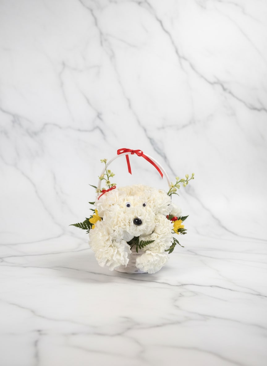 White flower basket arranged like a teddy bear with a red ribbon handle