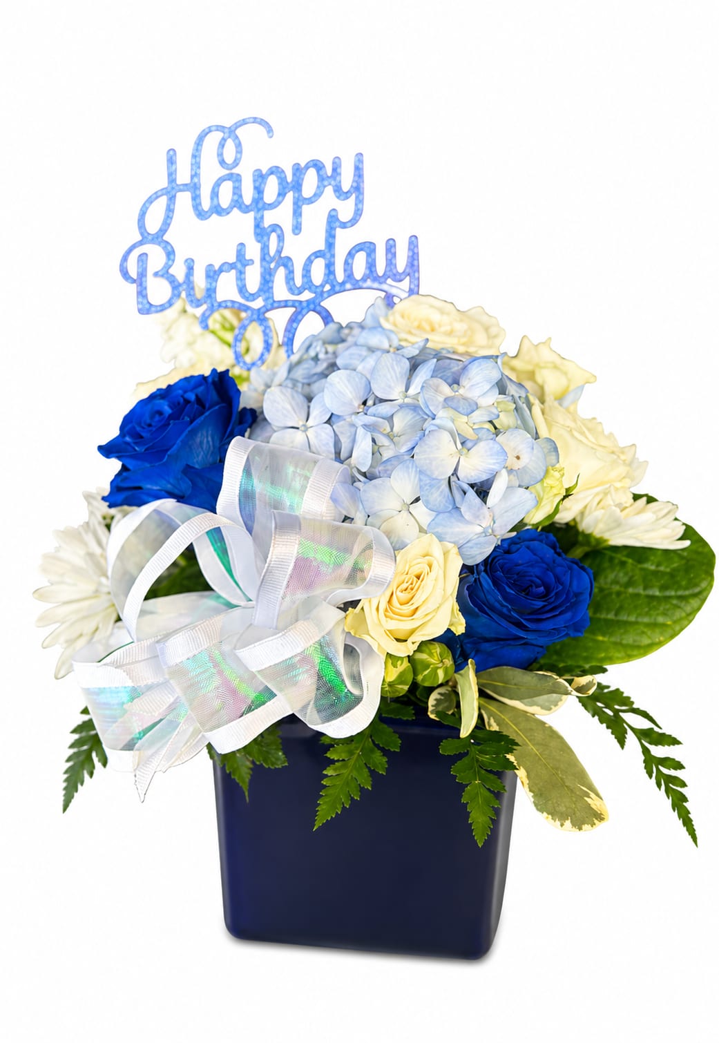 Blue and cream floral arrangement in a dark vase with a Happy Birthday topper