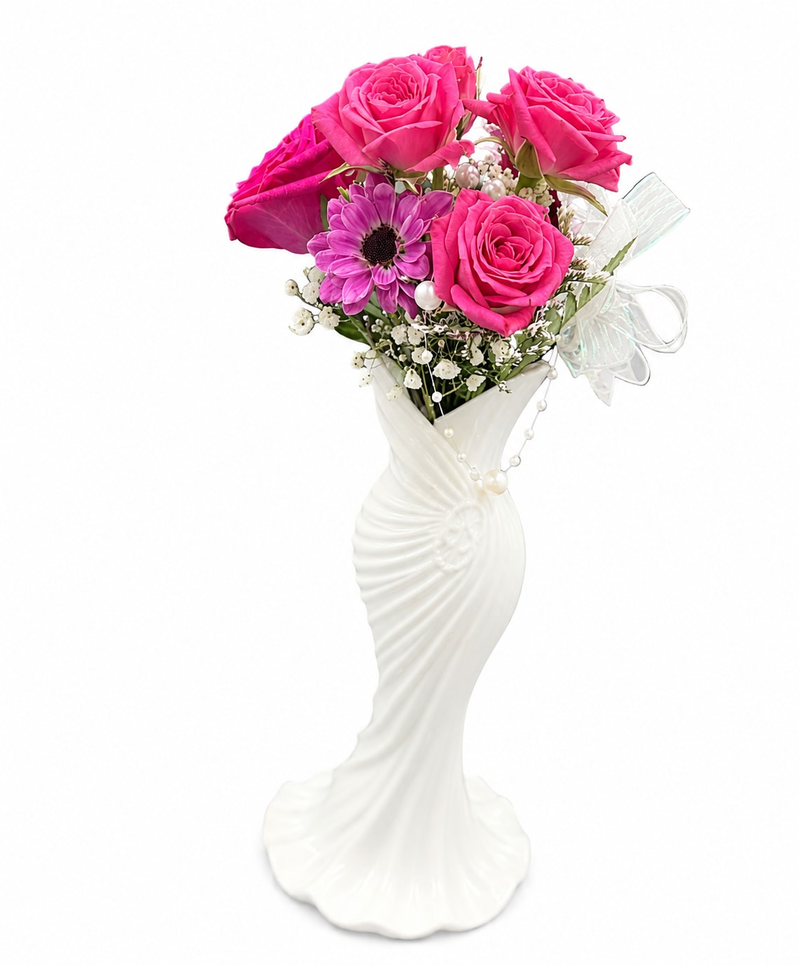 Pink roses and a purple daisy in a white vase