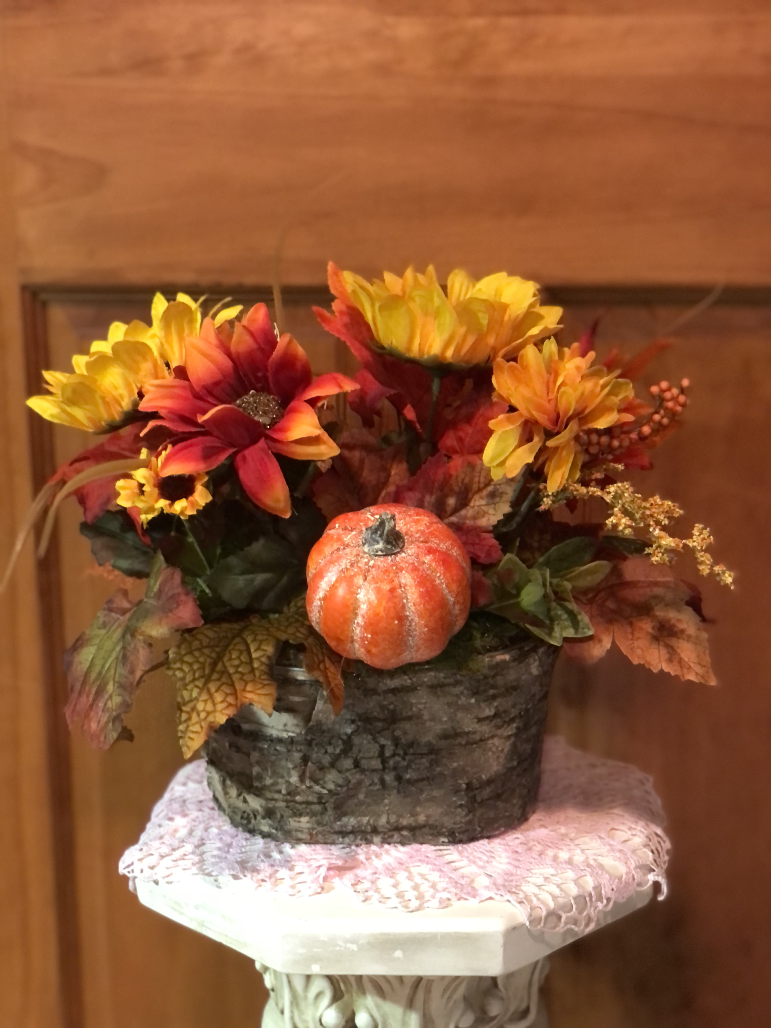 Fabricated Fall - Take a closer look and tell me if it's real. Beautiful silk sunflowers, fall mums, textured leaves, along with a pumpkin beckons fall feelings. Colorful on an entryway or coffee table to greet guests as they walk by. Your recipient will use every fall season. ( 1 available)