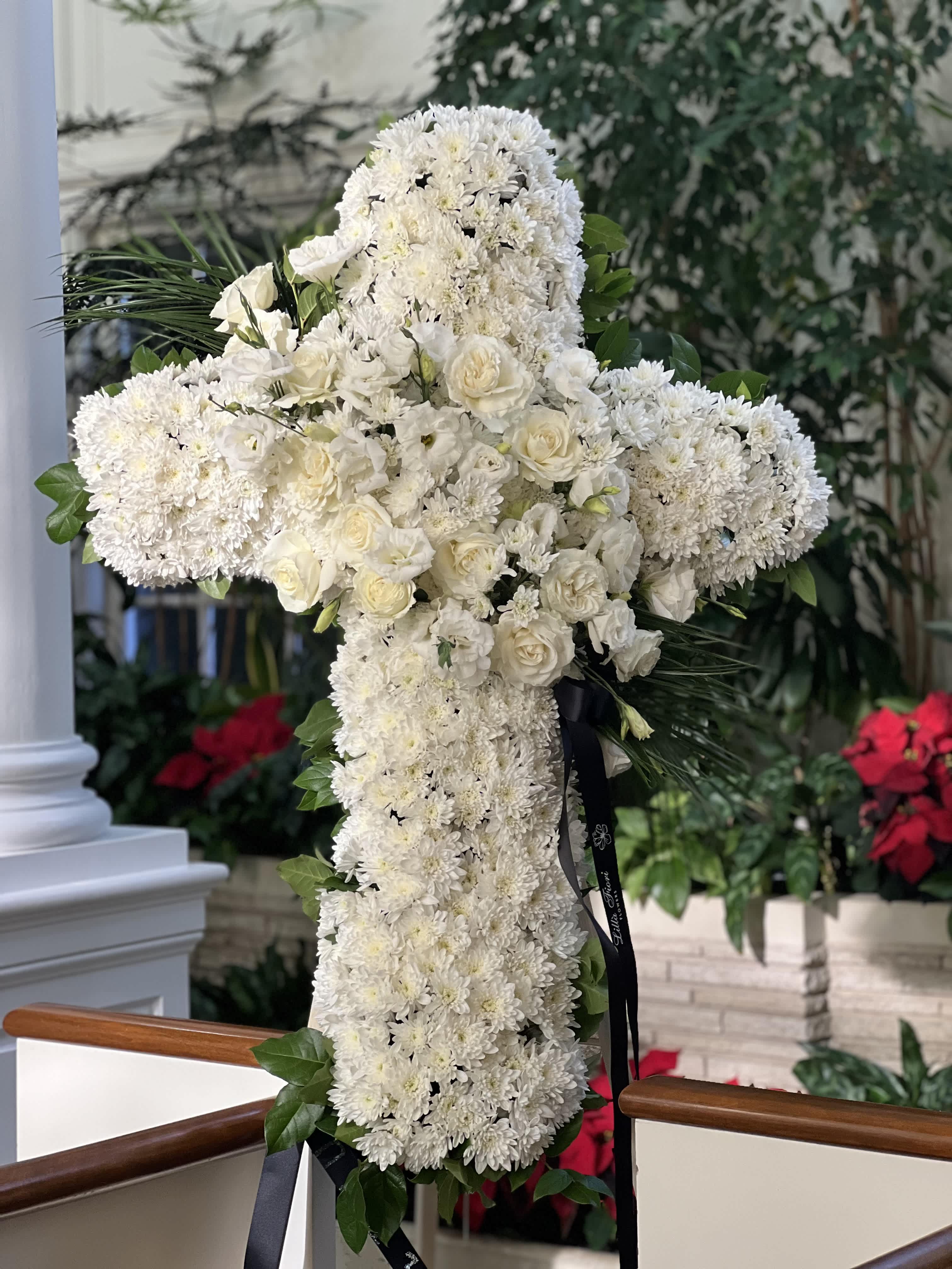 White floral cross arrangement with roses and chrysanthemums