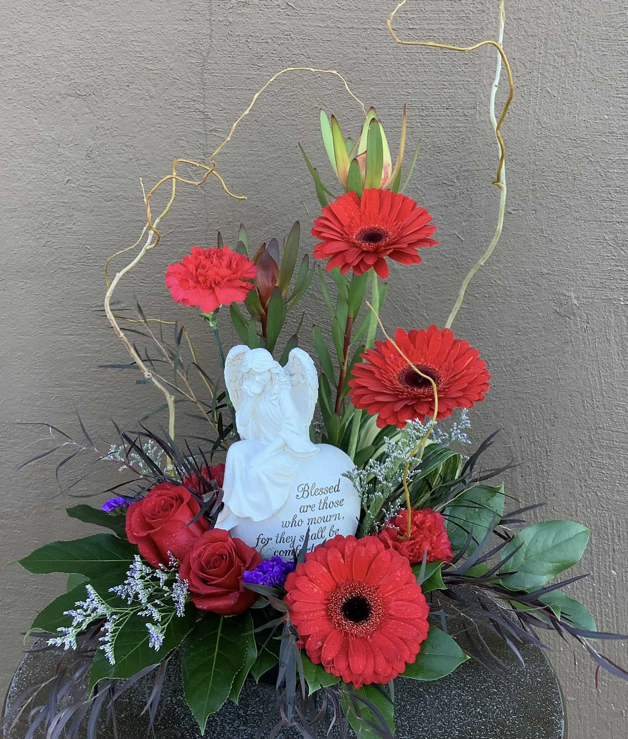 Blessed are those who mourn - This beautiful 8 inch statue with an angel that says “Blessed are those who mourn for they shall be comforted” is surrounded by summer garden flowers
