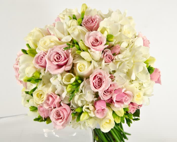 Bouquet of pink and white roses with white orchids