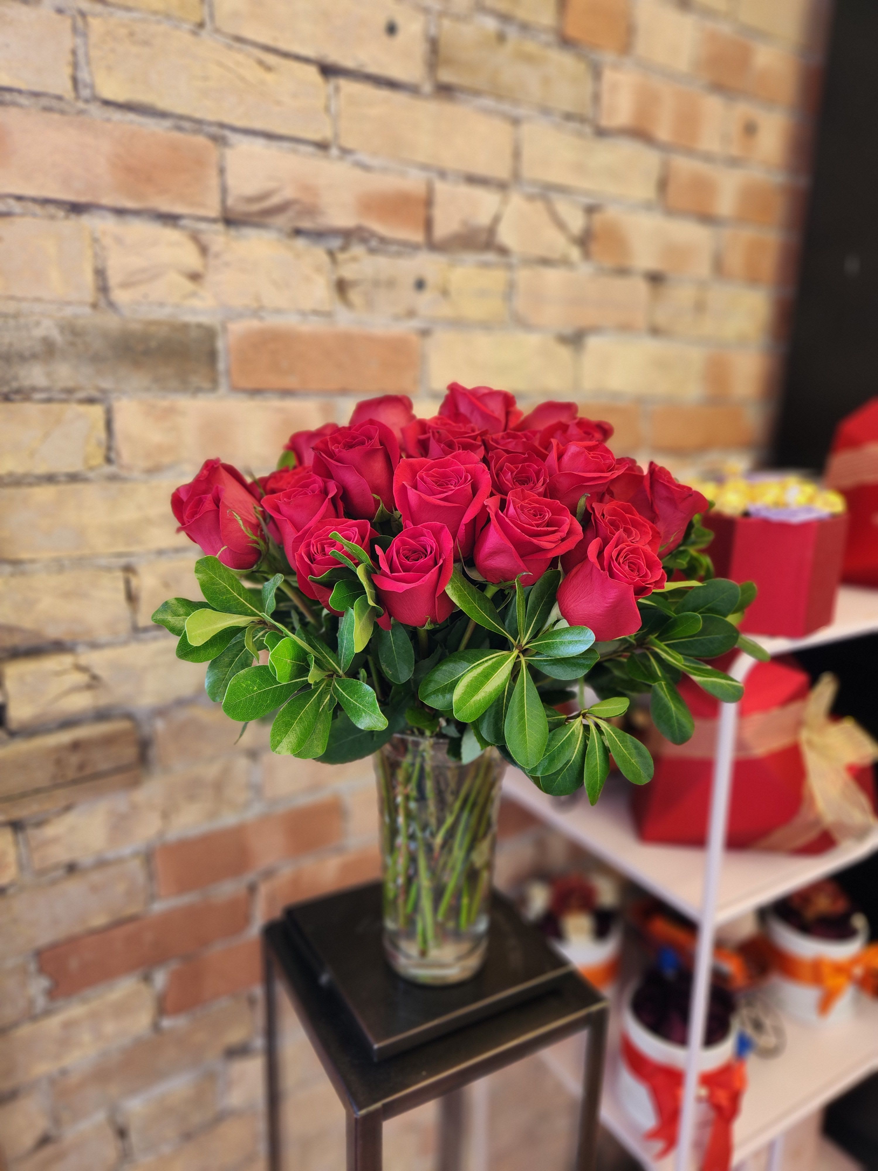 Bouquet of red roses in a clear glass vase