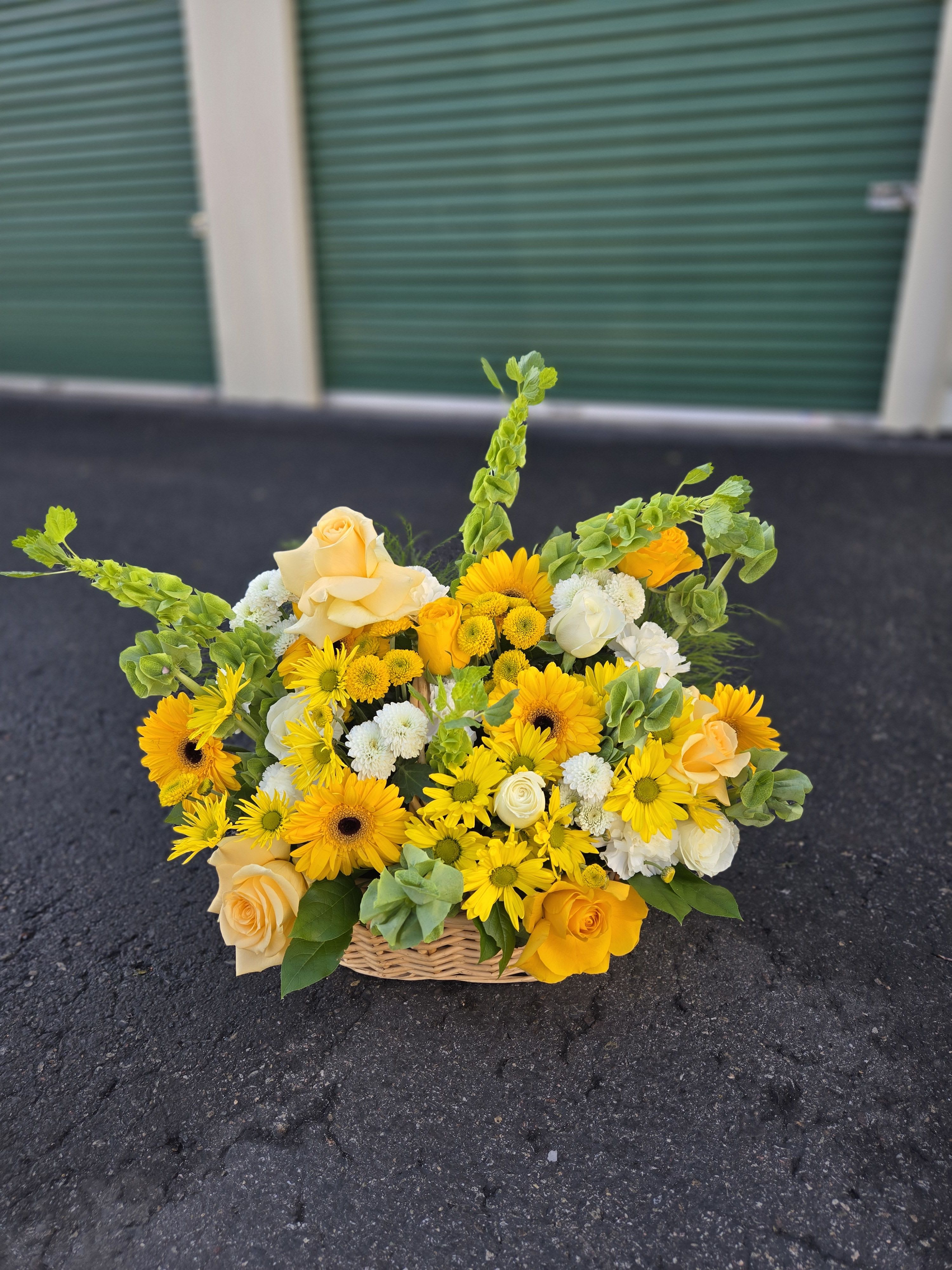 Yellow and cream flower basket with roses and daisies