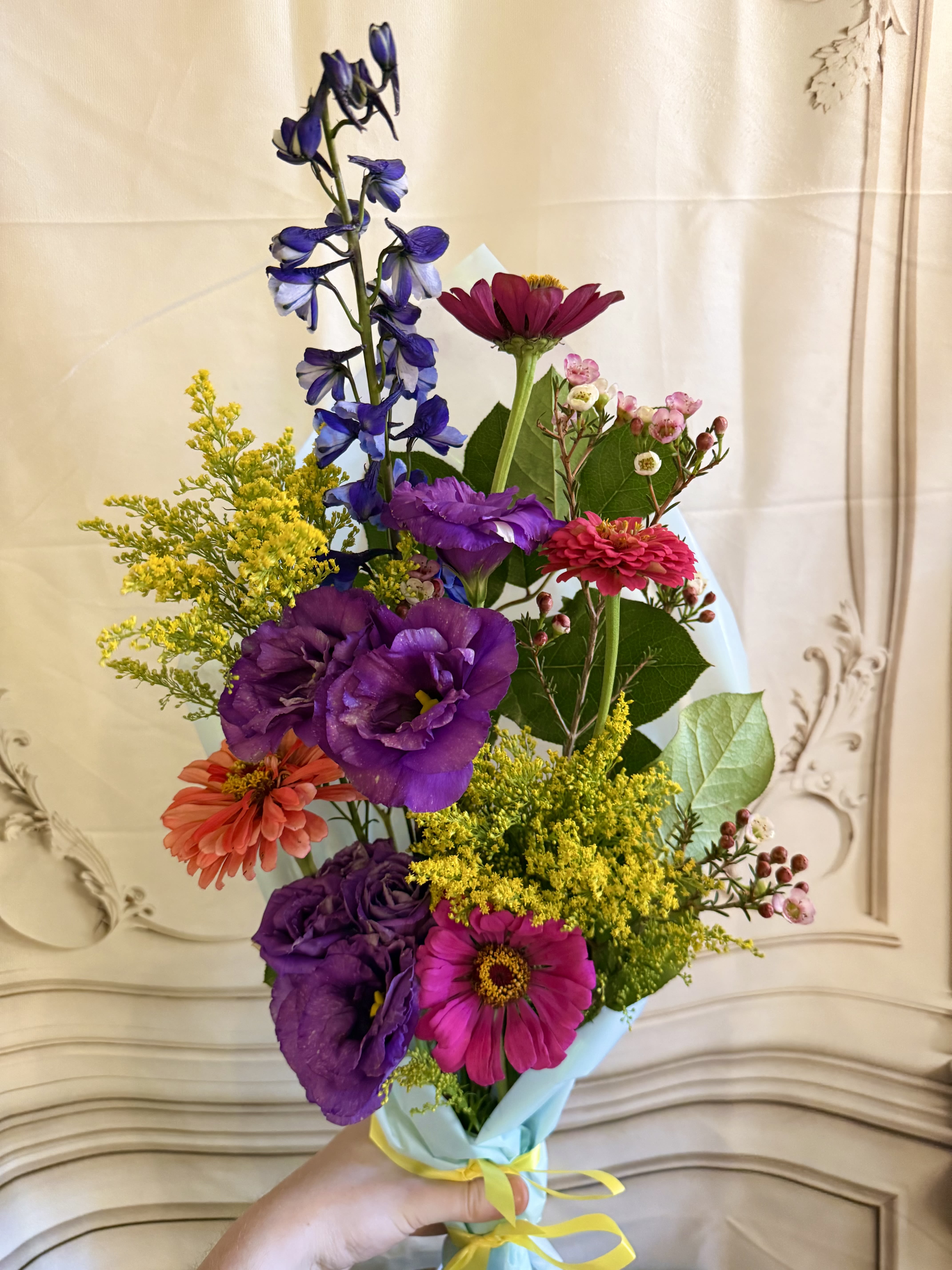 Local Bloom Wrapped Bouquet  - This beautiful wrapped bouquet Is filled with vibrant flowers grown in our own secret garden. Whether it's locally grown Zinnias, Dahlias, Lisianthus, Phlox, Yarrow, or another beautiful bloom, This bouquet is perfect for the Summer season. * *Each wrapped bouquet includes freshly harvested flowers from our local garden and will not look exactly as pictured.**
