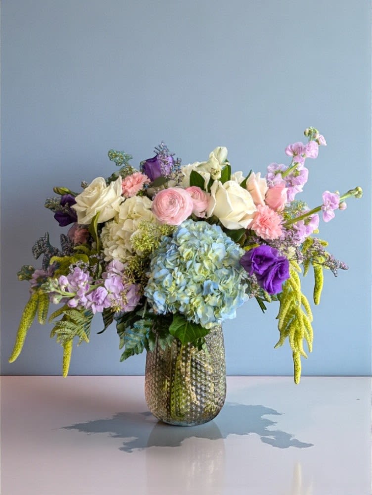 An Inspired Spring An Art and Flowers Exclusive - AN INSPIRED SPRING DESIGN – AN ART AND FLOWERS EXCLUSIVE Enjoy vibrant spring flowers with our Art and Flowers Original Designs, crafted by our talented designers using high-quality blooms. Designs may vary from those pictured. We will use only the freshest availably blooms, locally and internationally sourced. We guarantee fresh flowers for 5 days.  Photos shown are examples; actual bouquet design and flowers will differ based on availability and the designer’s interpretation. Design styles can vary from traditional to contemporary.  