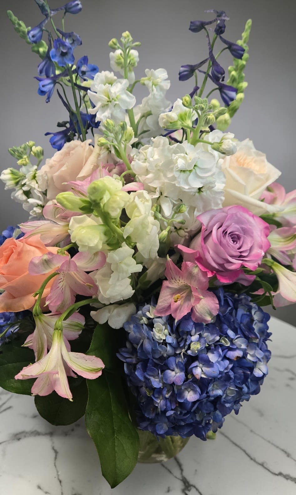 Art &amp; Flowers Exclusive "Diamond Love" - A giant luxury arrangement? Sign us up. Instead of sending standard red roses only, send them something soft and pretty and sweet to say "I care". We will use a seasonally fresh assortment of blooms in soft pastel tones. Vase shapes and sizes will vary depending upon the size design you choose.   The floral content may vary due to seasonal availability.  
