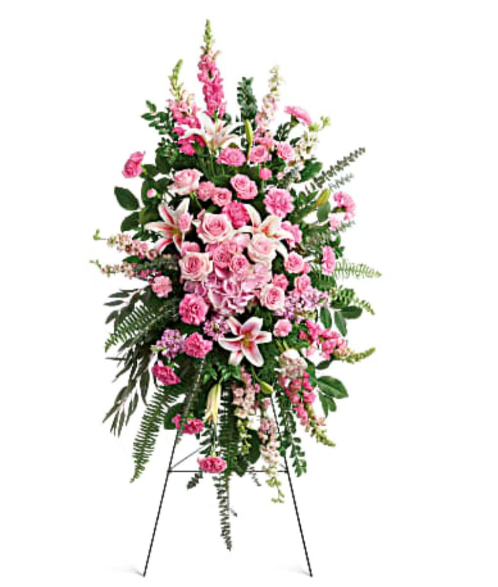 Tall pink floral standing spray on an easel