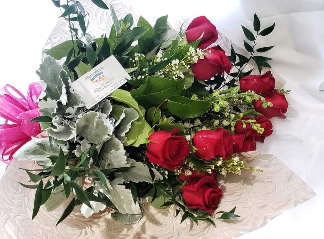 Bouquet of red roses with silver foliage and pink ribbon