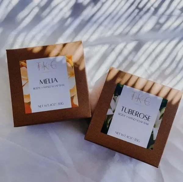 Two boxed body and hand soap bars labeled Melia and Tuberose