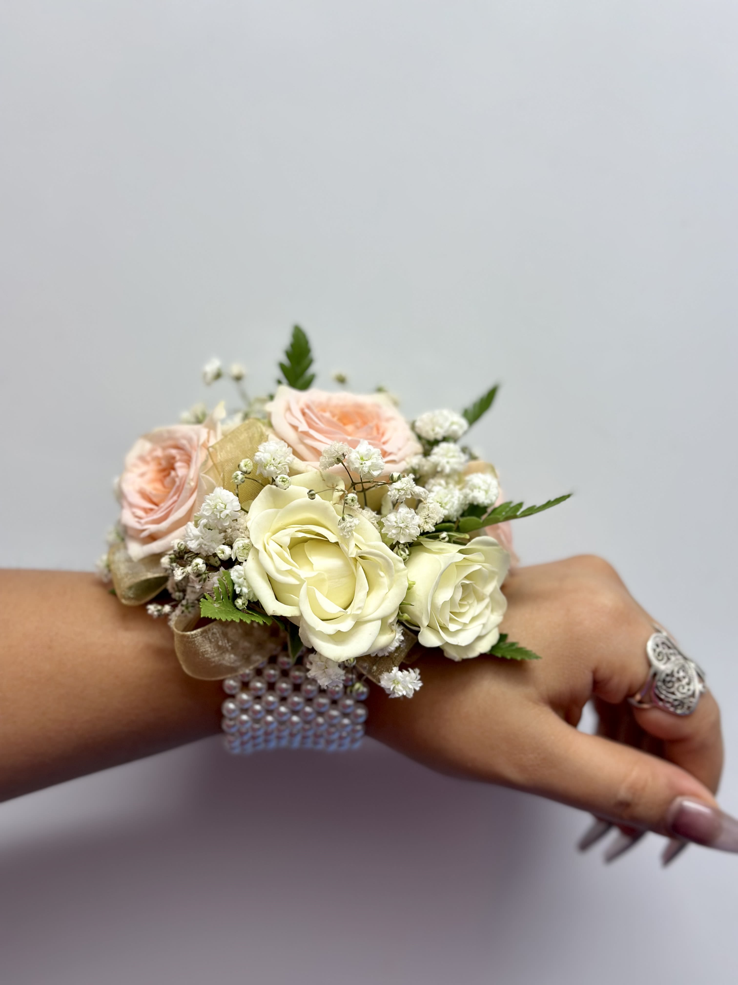 Elizabeth Corsage - Elizabet corsage is made with white spray roses and peach spray roses perfect for you special day like prom or any event.