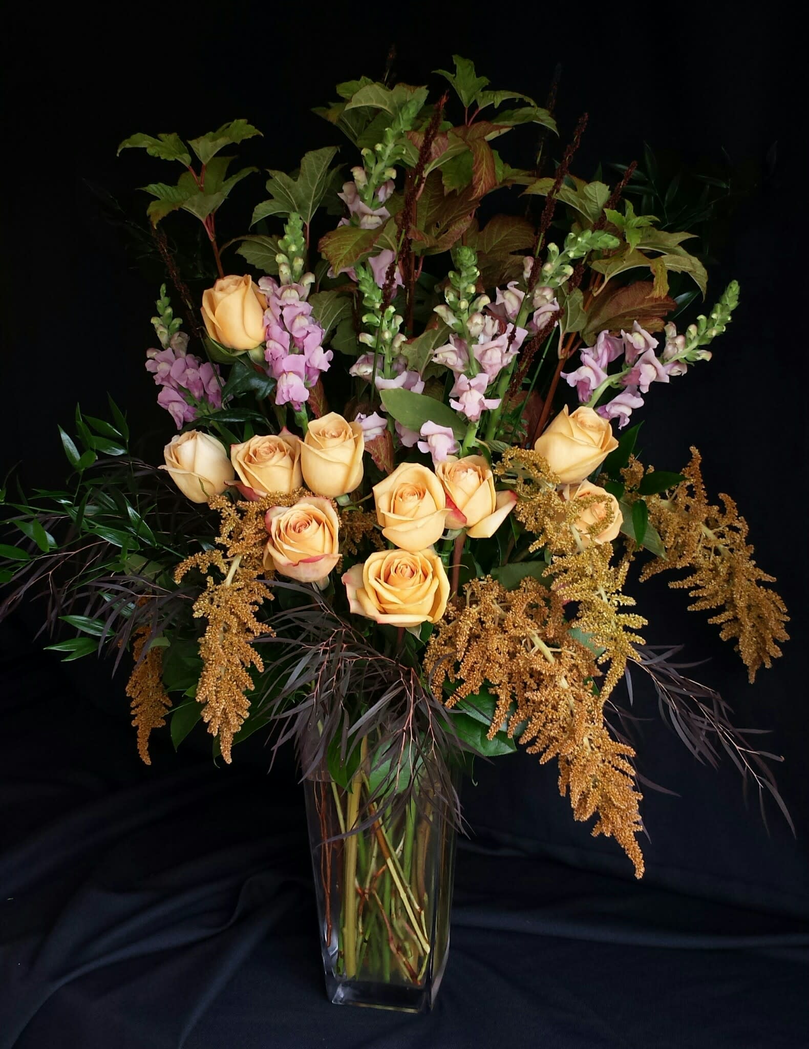  Dozen Long Stem Roses and Season's Best Flowers - Tall premium vase of Long stem Roses and our favorite flowers of the season. Flowers and colors will vary.  Shown here is an example of our Autumn assortment.  We will choose a unique and fun assortment no matter what time of year!