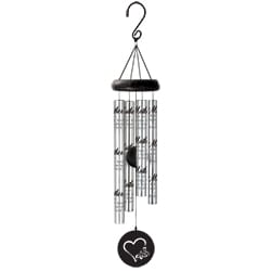 Hanging metal wind chime with silver tubes and a black heart medallion