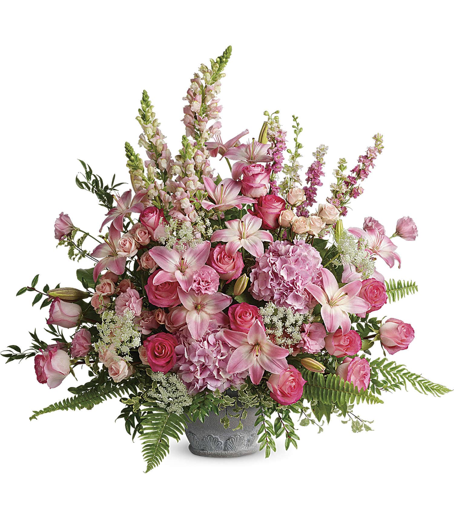 Pink roses and lilies arranged in a gray vase