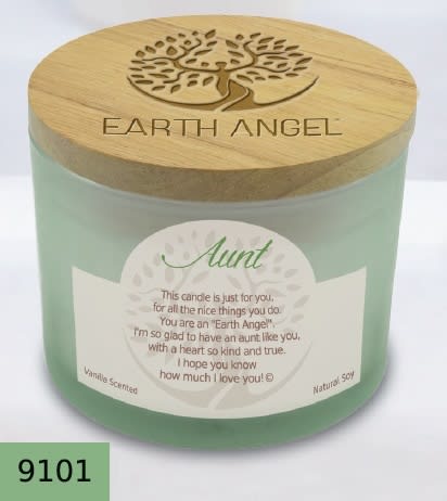 Green candle in a glass jar with a wooden lid