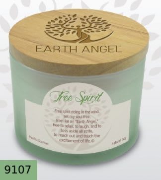 A mint-green candle jar with a wooden lid and printed label