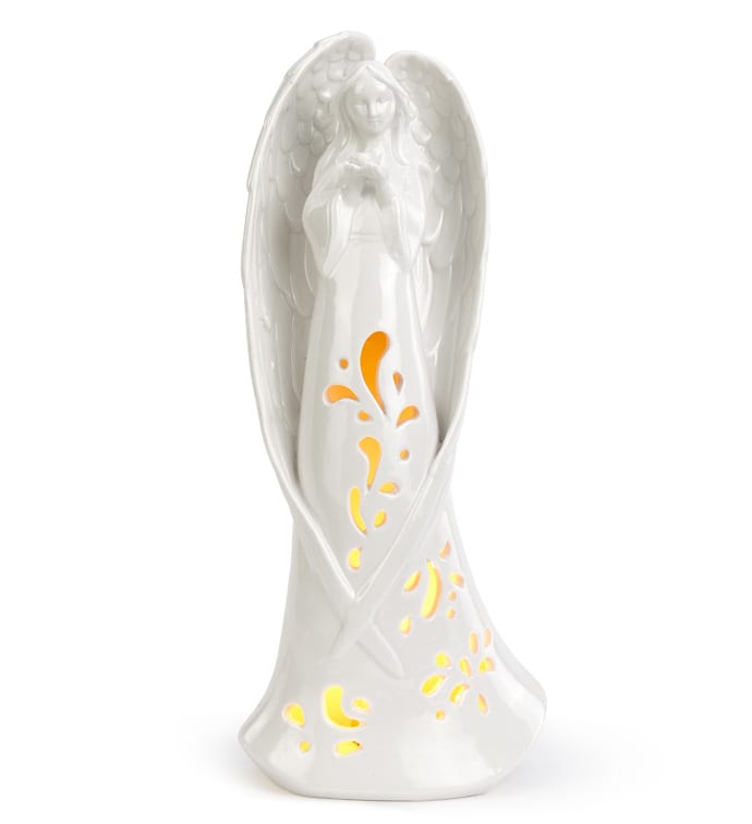 White angel figurine with glowing cutout floral accents