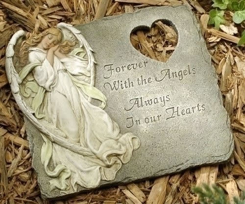 Memorial stone with an angel relief and heart cutout