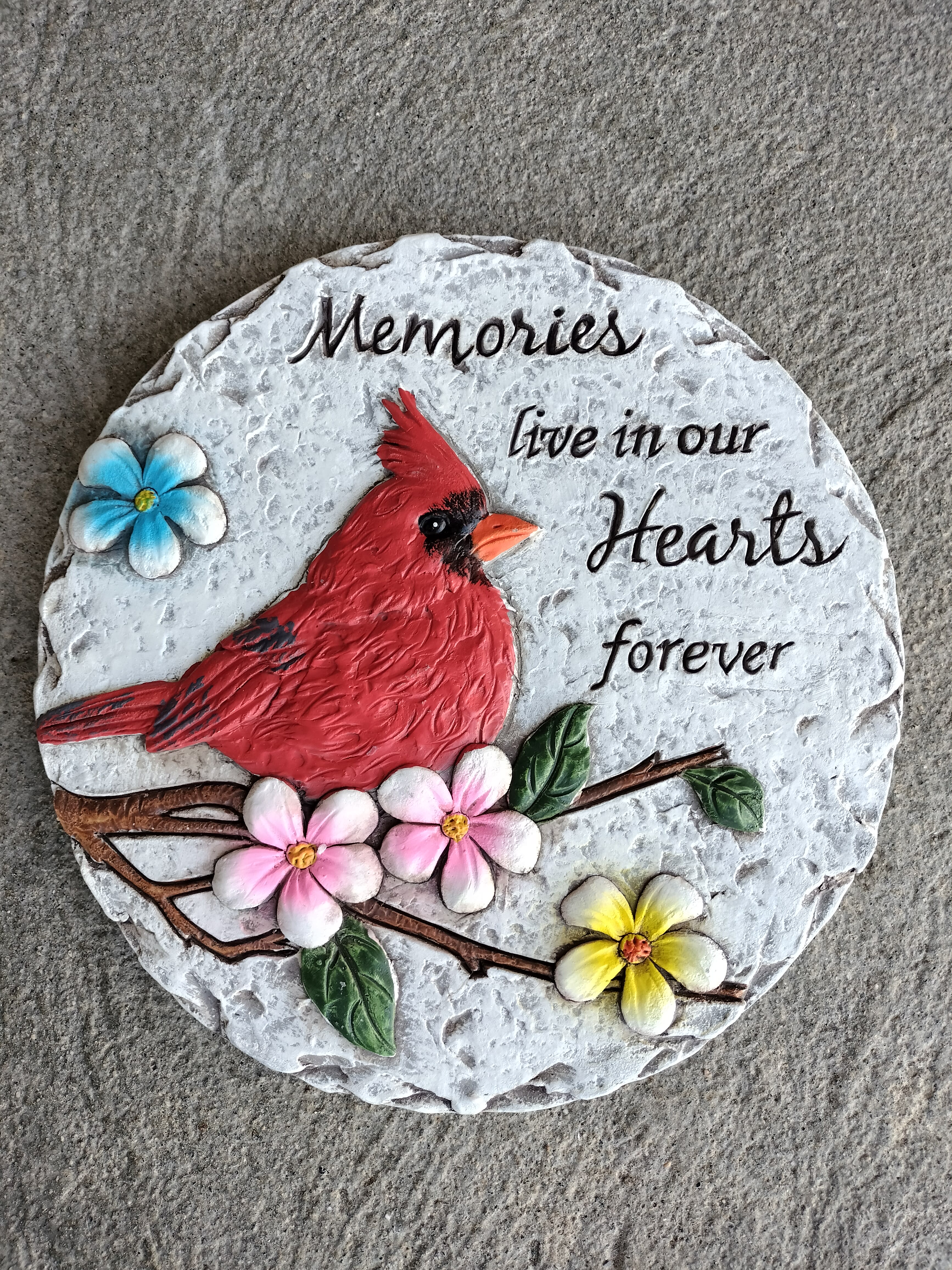 Decorative memorial plaque with a red cardinal and painted flowers