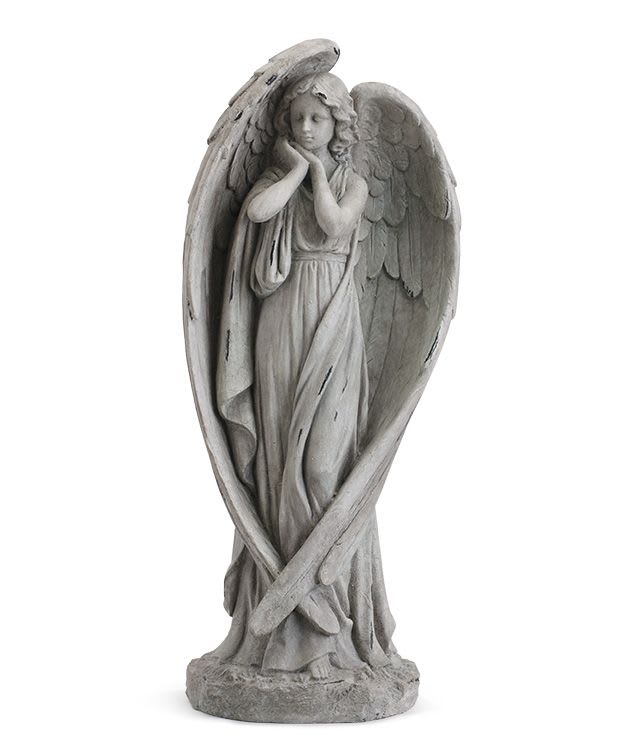 Gray angel statue with folded wings and a halo