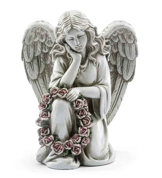 Stone angel figurine holding a pink rose wreath